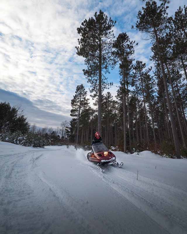 snowmobiler on winter trail