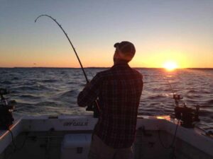 Fishing on Lake Michigan at sunset